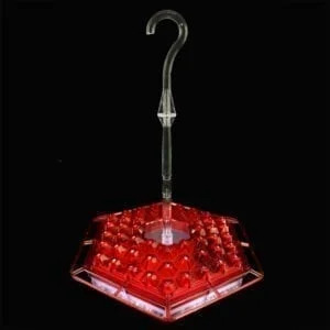 A red umbrella feeder with a light on top.