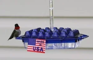 A blue container with eggs in it and an american flag on top of the lid.