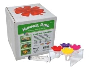 A box of hummer rings with some flowers in it