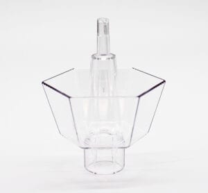 A clear plastic container with a handle on top.