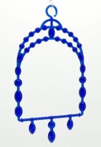 A blue bead necklace hanging on the wall.